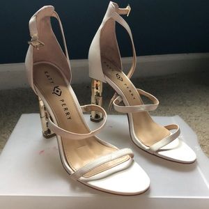 White heel with gold chain back.